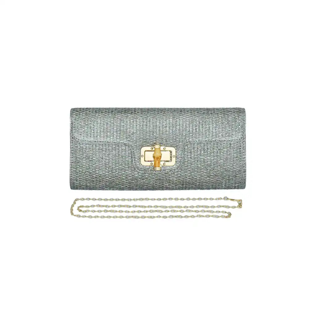 silver straw clutch bag with a bamboo clasp and chain strap on a white background