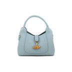 milan Light blue vegan leather handbag with a bamboo buckle on a white background