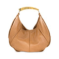 A tan leather hobo shoulder bag with a curved, polished tortoise resin handle, shown against a plain white background.