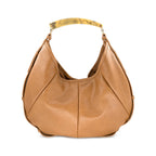 A tan leather hobo shoulder bag with a curved, polished tortoise resin handle, shown against a plain white background.
