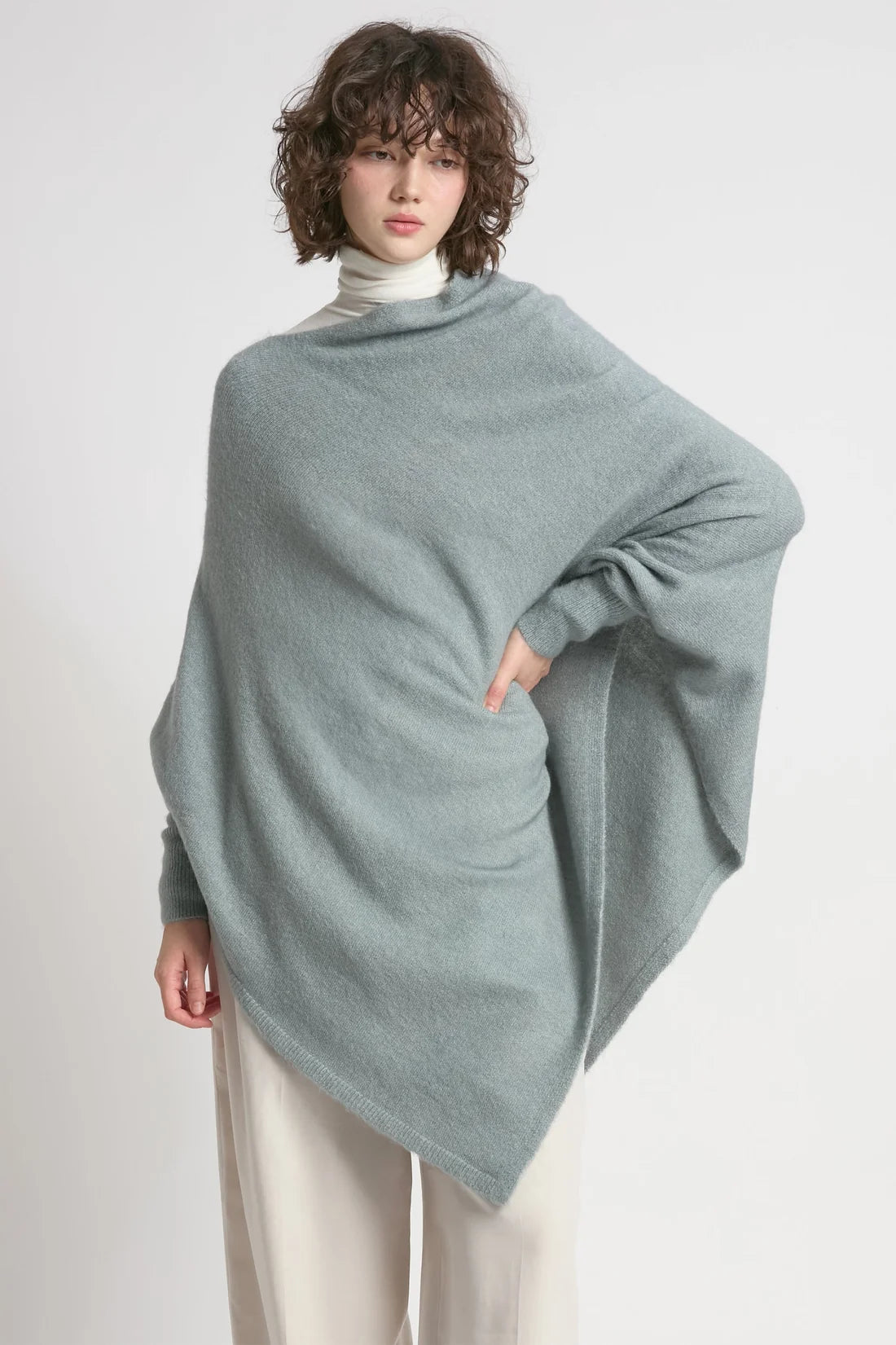 Dusky pink triangle poncho with sleeves, worn view
