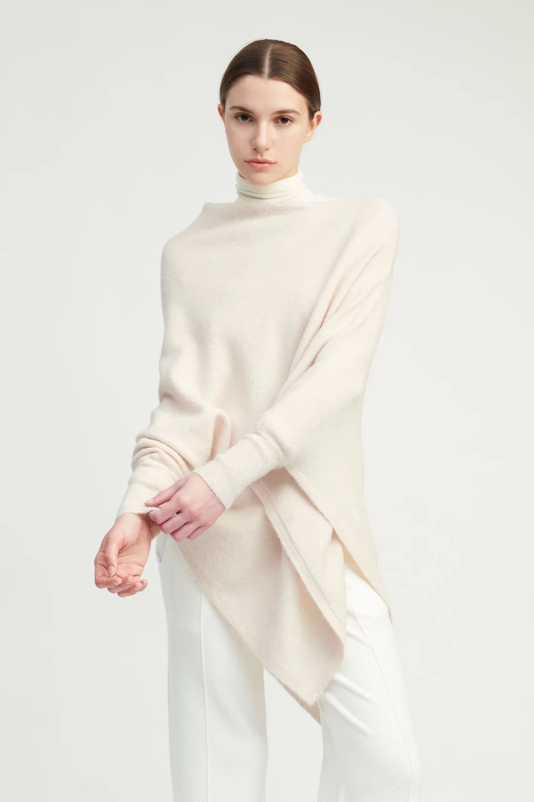 Ivory triangle poncho with sleeves, worn view