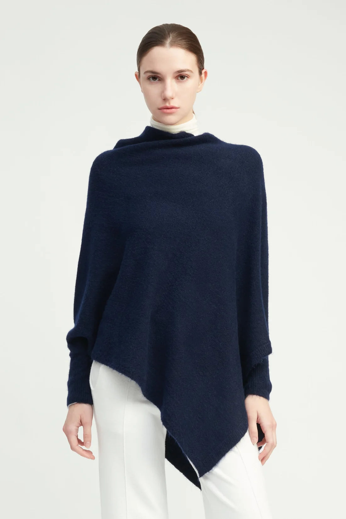 Navy triangle poncho with sleeves, worn view