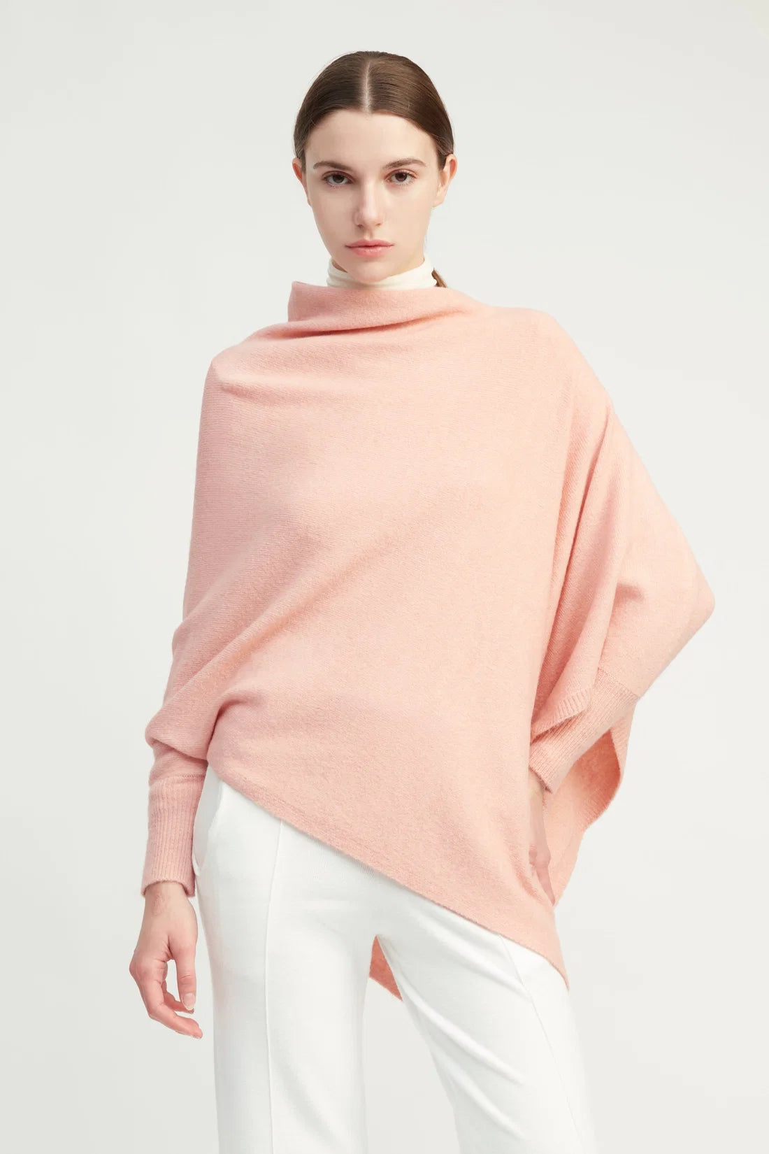 Pink triangle poncho with sleeves, worn view