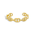 Gold cuff bracelet with mariner ring design