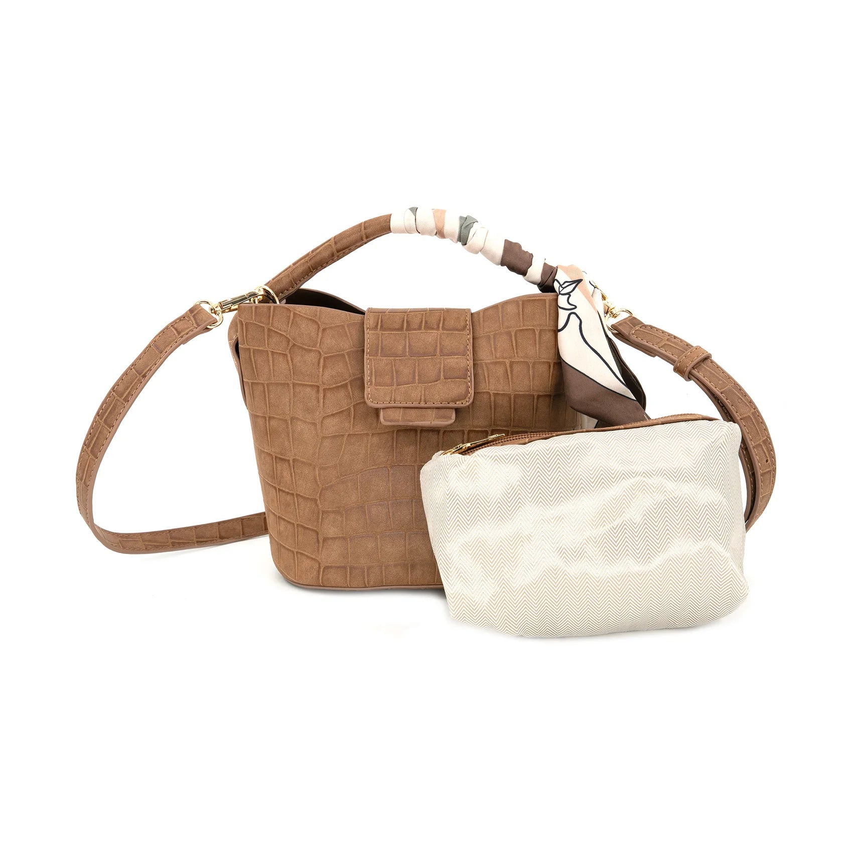 A brown crocodile-embossed leather handbag with a matching crossbody strap and a cream-colored  pouch placed in front of it, set against a plain white background.